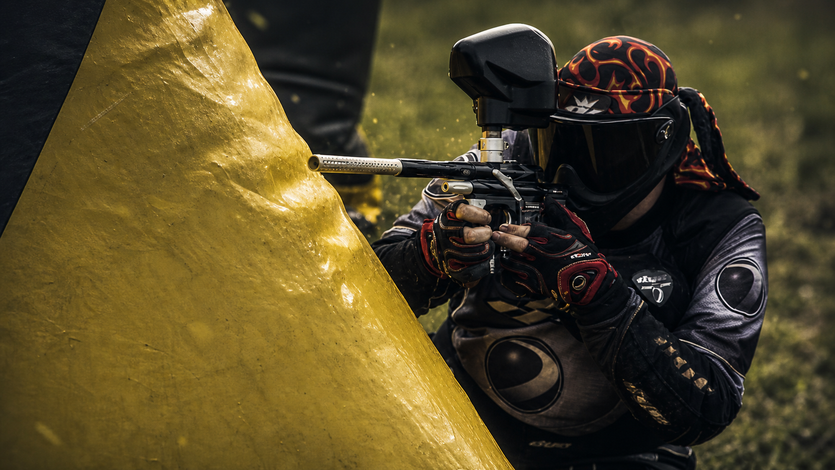 Mikhail Bakhman taking a tactical position during a paintball match